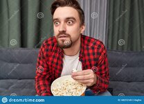 shocked-man-eating-popcorn-watching-movie-surprised-handsome-bearded-male-fresh-suspense-tv-wi...jpg